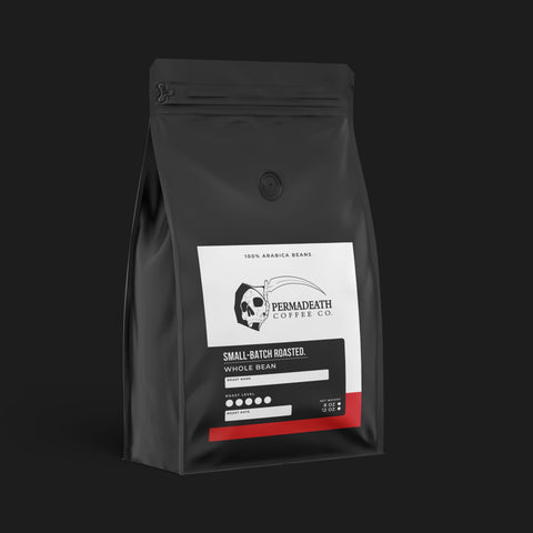 Black coffee bag with a label on a black background